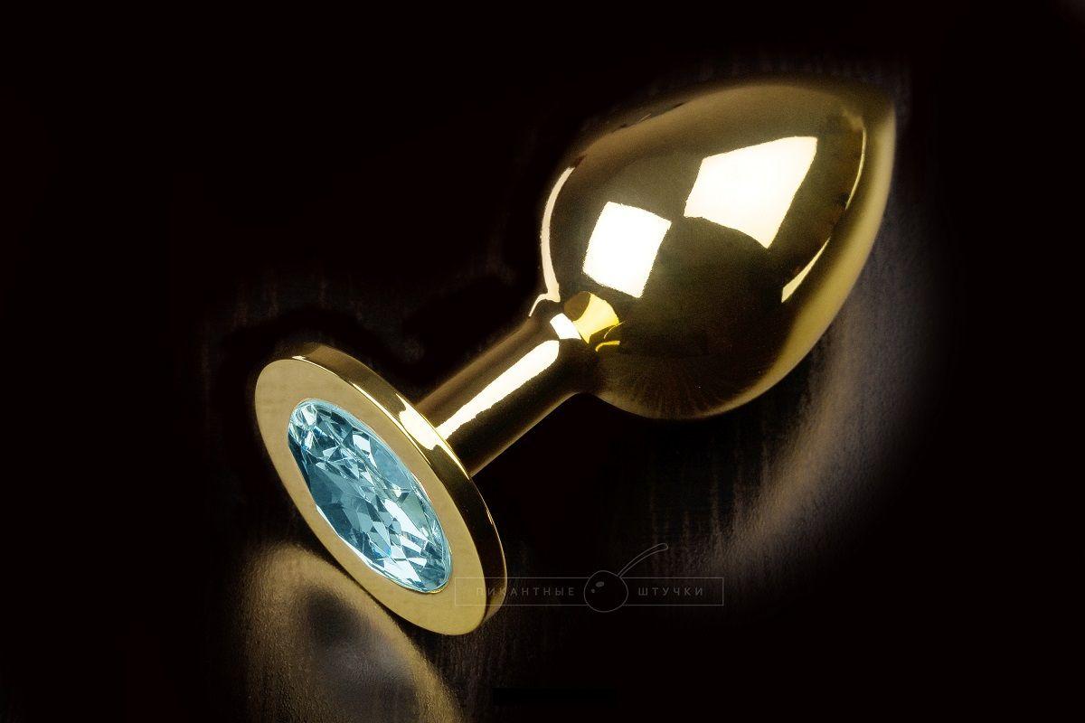 Большая золотая анальная пробка с закругленным кончиком и голубым кристаллом - 9 см..-5691